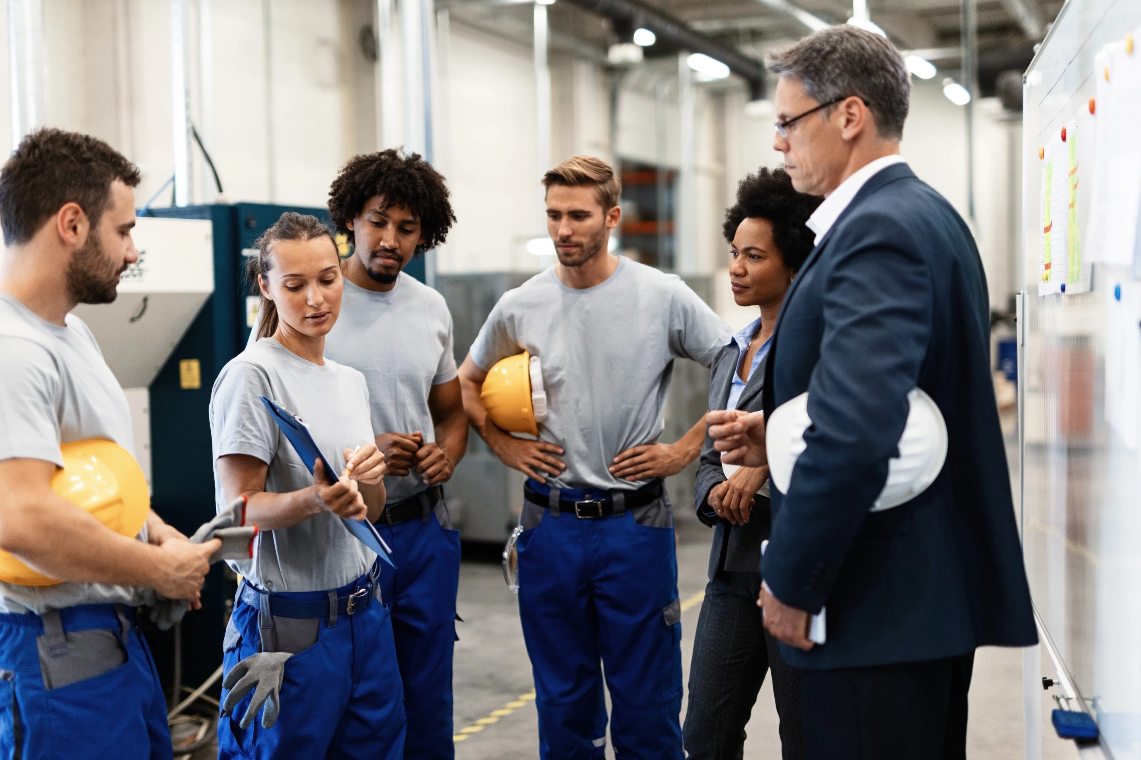 staff at plumbing in a warehouse talking